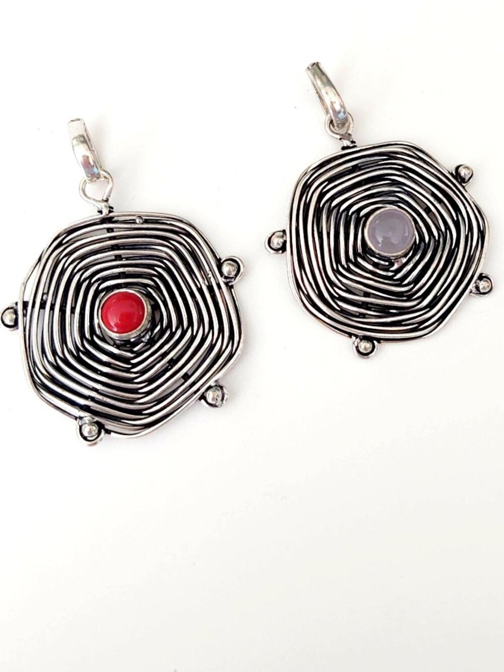 Pair of silver w/red & smoky purple stone pendants